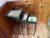 Three metal nesting tables with mirrored tops, showing overall size and scuffs.