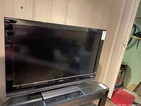 Front view of Sony Bravia 40-inch TV showing the screen and stand.