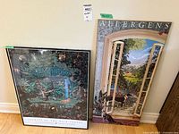 Both posters displayed leaning against wall, showing size and framing of rain forest poster and design of allergens poster