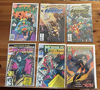 Six bagged and boarded comic issues displayed front covers