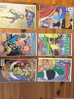 All six comic books laid out in two rows