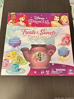 Front view of Disney Princess Treats & Sweets Party Game box
