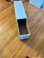 Inner drawer partially pulled from outer sleeve showing divider slots