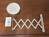 Full view of mirror with scissor arm extended