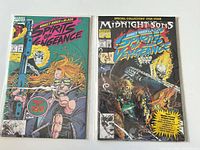 Both bagged comics side by side showing covers and protective sleeves