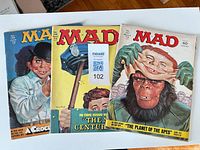 Front covers of the three MAD Magazine issues showing titles and artwork