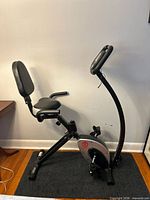 Full side view of Marcy exercise bike showing seat, backrest, handlebar and frame
