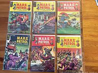All six bagged and boarded M.A.R.S. Patrol: Total War comics displayed