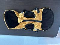 Top view showing hood, zipper, harness openings