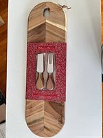 Front view of board and packaged utensils