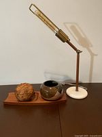 All three items: lamp, wood tray, pottery bowl displayed together