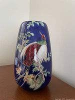 Front view showing bird motif and glazing