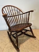 Front angle view of oak Windsor-back rocking chair