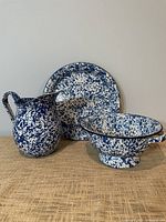 Group shot of plate, pitcher and colander