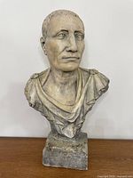Front view of Julius Caesar bust on plinth