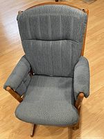Front view of blue-grey upholstered maple glider chair