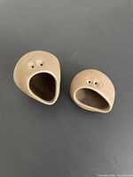 Pair of Robert Maxwell stoneware Critters figures front view