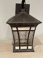 Front view of lantern showing ripple glass and stained glass border