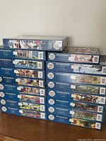 Side view of entire stack of Cobble Hill puzzles