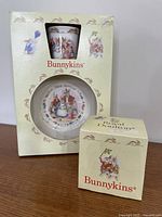 Two boxed Bunnykins products: 2-piece set and separate mug
