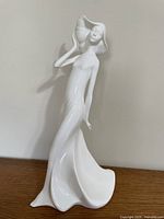 Front view of white porcelain Royal Doulton Carefree figure