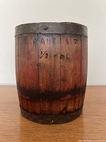 Front of barrel showing carved label and iron bands