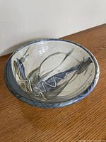 Angled side view of signed Wayne Cardinalli stoneware bowl showing glaze pattern and form