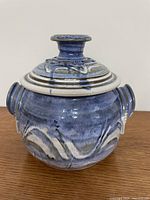 Front view of lidded bean pot showing glaze and lid