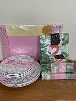 Group showing all plates stacked, sealed placemats, three napkin packs