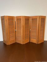 Front view of all six shutters standing upright