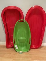 All three sleds standing upright showing size and colours