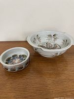 Large and small Joseph Panacci bowls side by side