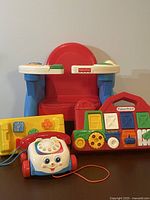 Group shot of four Fisher-Price toys