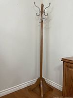Full view of oak coat rack showing base and height