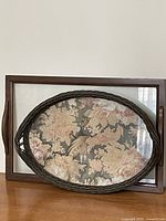 Both trays front view showing size and style contrast