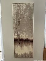 Full view of tall narrow framed print hanging on wall