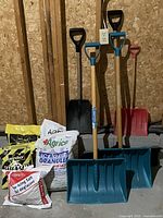 Group shot of all shovels and de-icer bags
