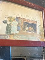 Full view of the framed picture and mirror showing two women by the fireplace.