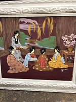 Full view of mid-century painting showing five women in traditional dress in a garden with stylized nature elements and white ornate frame.