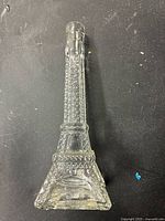 Top view image showing the detailed lattice texture and narrow neck of the Eiffel Tower-shaped clear glass decanter.