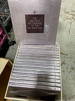 Box sets stacked showing the spines of volumes 39 to 55 with artist and volume labeling; shrink wrapped condition visible.