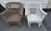 Pair of resin glider chairs; one brown and one white, showing their wicker look and gliding base.