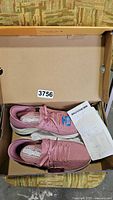 Photo of pink Skechers slip-on shoes in box with tags and receipt visible