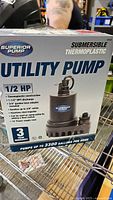 Front view of box showing brand Superior Pump, product name 'Submersible Thermoplastic Utility Pump', 1/2 HP motor, 3 year warranty, and pump specifications.