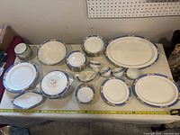 Full view of entire dinnerware and serving set on table