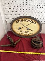 Group shot of sign, anchor, pulley with measuring tape