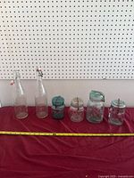 Front view of all six bottles and jars lined up