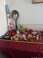 Entire lot arranged on table showing variety of toys and vehicles