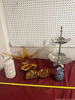 Group shot showing all items in lot on red cloth