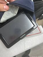 Photo of Garmin GPS device screen showing device size and condition